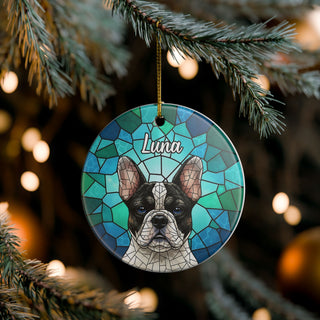Decorative ornament with a dog illustration and 'Luna' text, hanging on a Christmas tree.