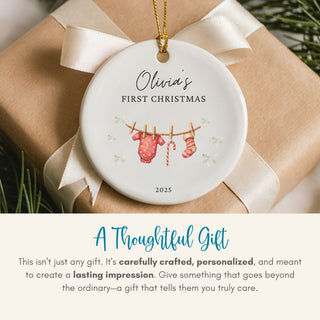 Personalized Christmas ornament for 'Olivia's First Christmas' on a gift box with text about thoughtful gifts.