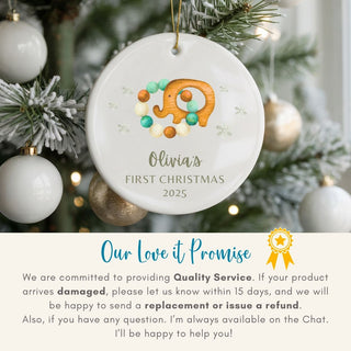 Personalized Christmas ornament with elephant design on a decorated tree, featuring 'Our Love it Promise' text.