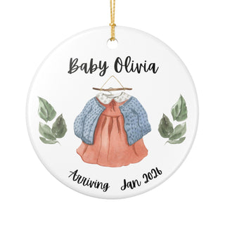 Watercolor baby outfit ornament design, personalized with name and year, ideal for pregnancy reveal, baby shower, or Christmas gift for expecting parents.