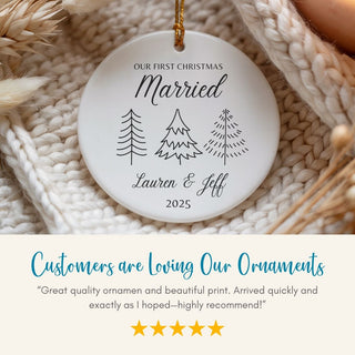 Decorative ornament with 'Our First Christmas Married' text and tree illustrations on a textured surface.