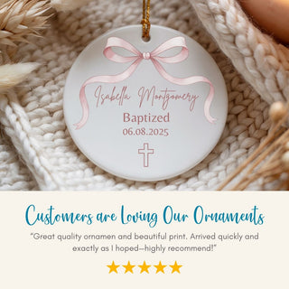 Personalized ornament with pink ribbon and text on a textured surface