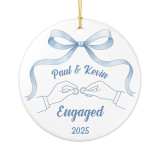 personalized ceramic ornament featuring two hands exchanging rings with blue ribbon, perfect gay couple engagement gift for first Christmas