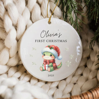 Decorative ornament for 'Olivia's First Christmas' with a baby reindeer design on a textured surface.