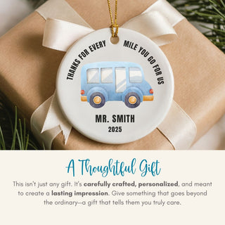 Personalized ornament with a blue car illustration and text on a wrapped gift.