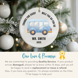 Personalized ornament with a blue car design on a Christmas tree, featuring text and a brand promise.